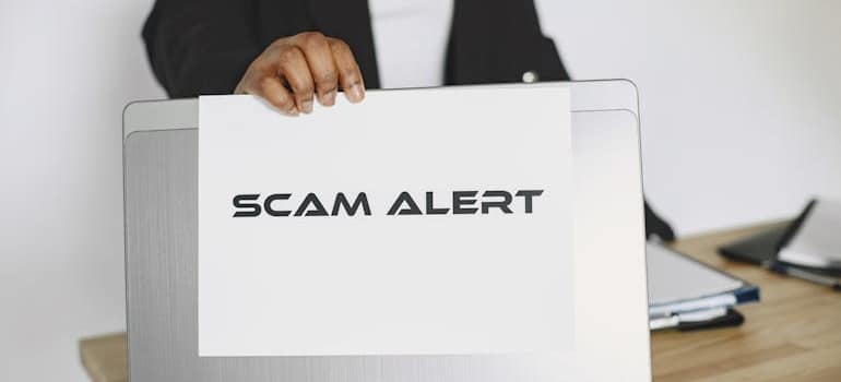 Scam alert written on laptop
