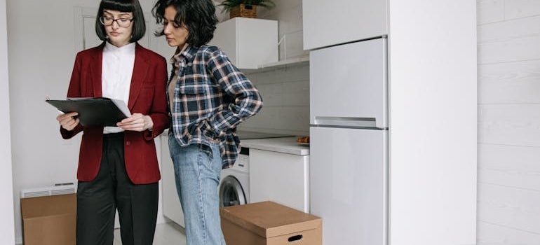 A woman showing a moving estimate to a client