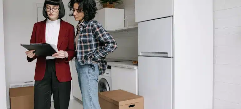 A woman showing a moving estimate to a client