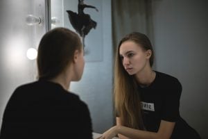 A women looking in the mirror