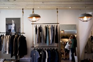 a room with things such as clothes, pictures etc