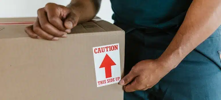 A man providing packing assistance for fragile items