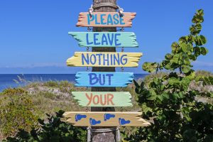 A sign that reads: "Please leave nothing but your footprints"