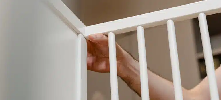 A person setting up a child protection fence