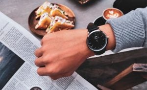 A man looking at a watch