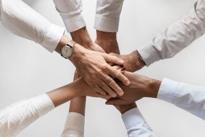 Eight people huddling