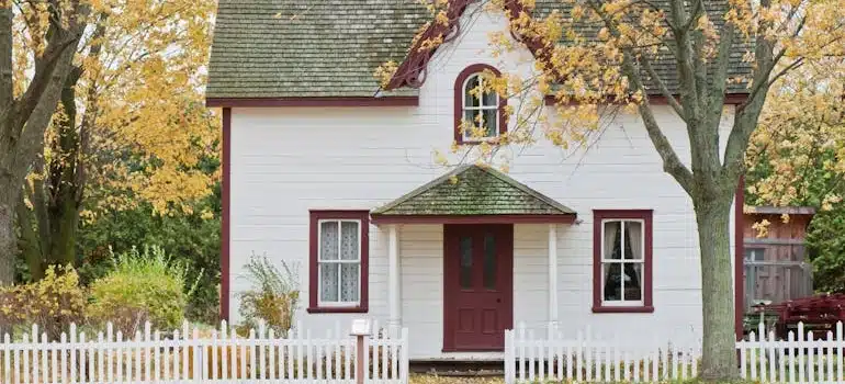 White and Red Wooden House With Fence in London, ON, Canada