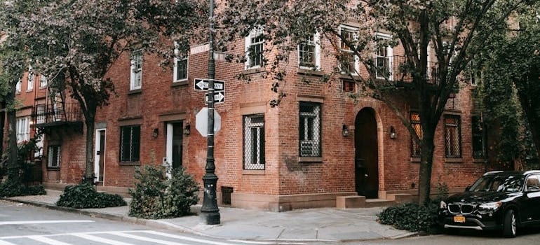 Brown Brick Building Near Green Trees in NYC