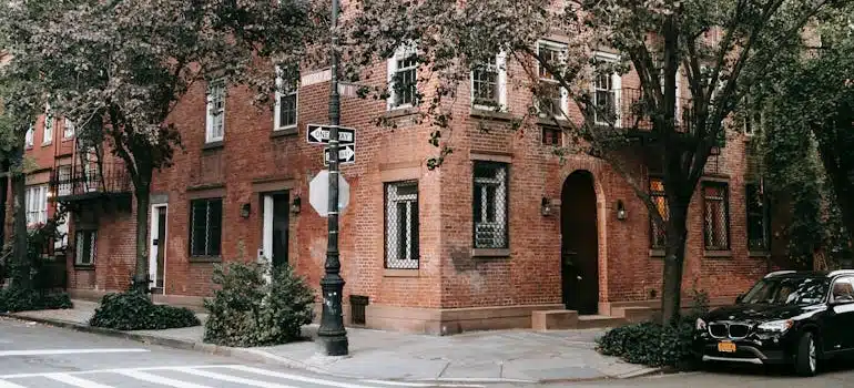 Brown Brick Building Near Green Trees in NYC