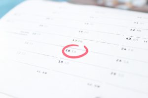 Calendar with circled date.