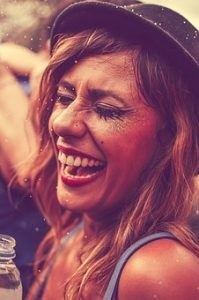 A girl smiling and having fun at a festival 