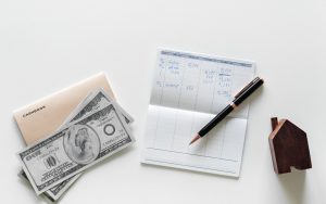 Money and calculations on a desk.