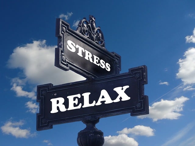 A sign with written "stress" and "relax" on it,