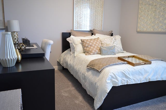 Grey bedroom with a king size bed.