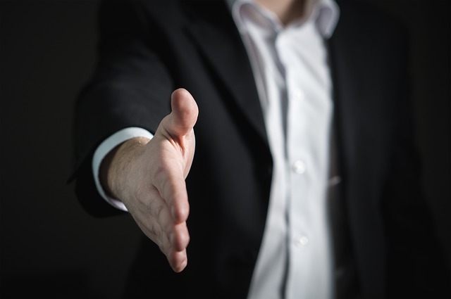 Man preparing to shake hands.