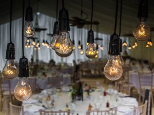 event setup Miami - light bulbs and tables