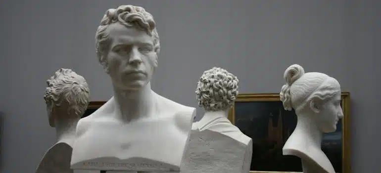 Four busts in a gallery