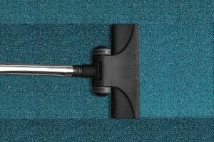 A vacuum cleaner on a carpet