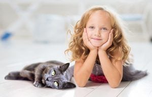 A girl and a black cat