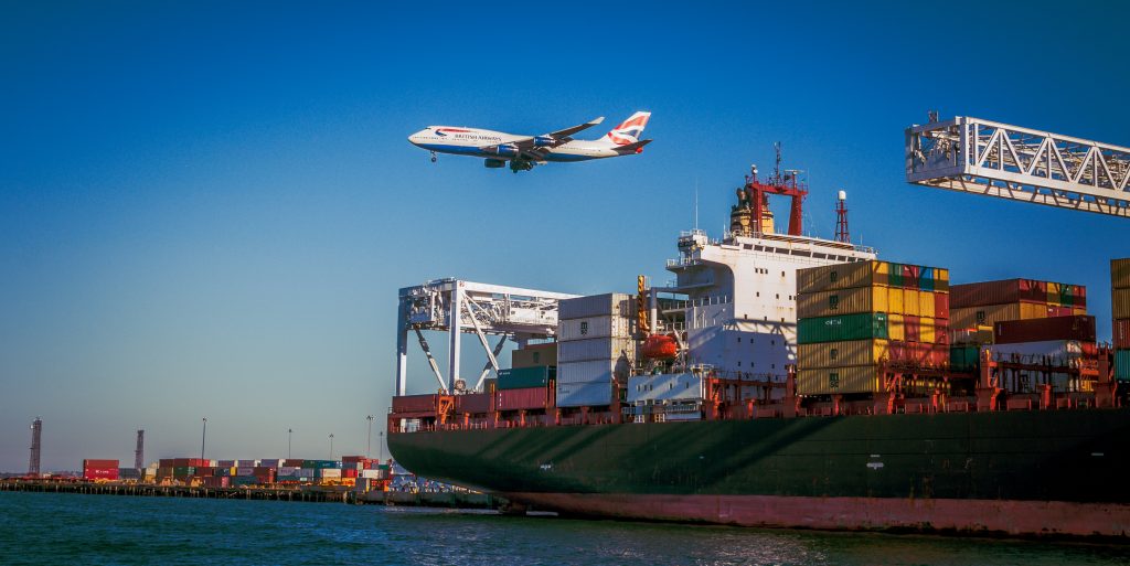 a plane in the air, representing cargo pickup and delivery services