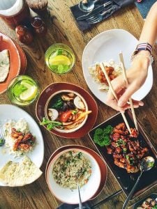 Aerial view of food and plates on a table.