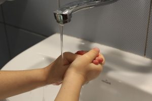 A child washing his hands.