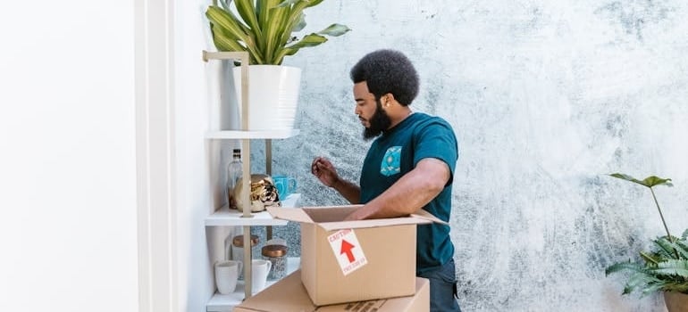 A mover plans how to efficiently pack fragile items on a shelf