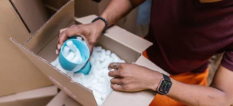 A man with packing peanuts needs to ind packing supplies in FL