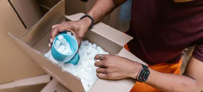 A man with packing peanuts needs to ind packing supplies in FL