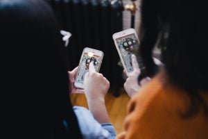 two women on their phones planning a small move in Florida