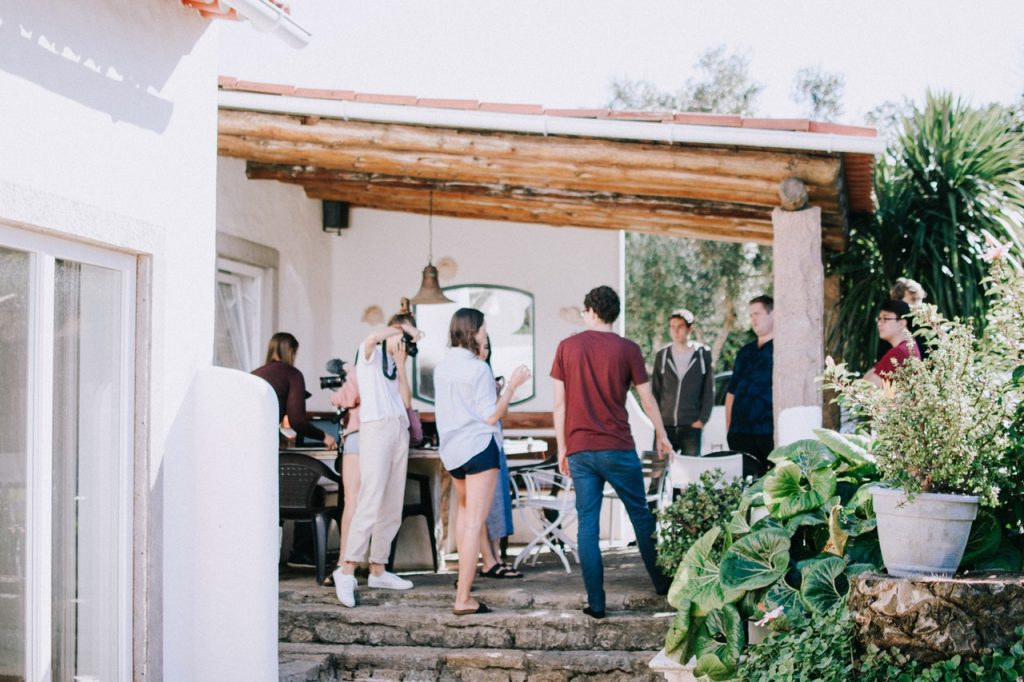 People standing in a backyard talking