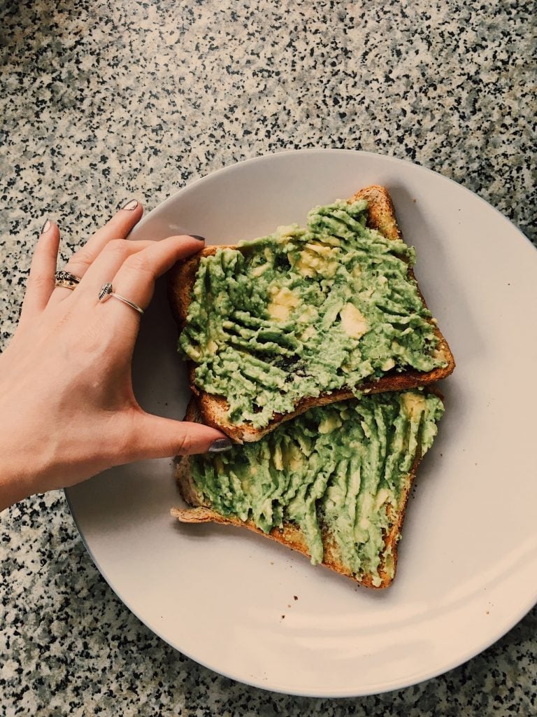 Two slices of toast with guacamole