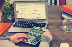 a woman using calculator 