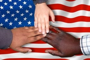 Hands on an American flag