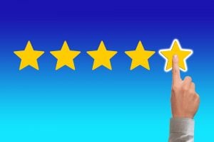 trustworthy movers for a hotel relocation -five star rating and a finger pointing to the fifth star