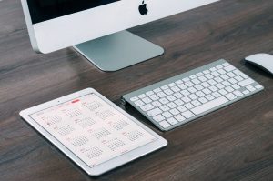 moving tips for service members - a macbook and a tablet on which you can see the calendar