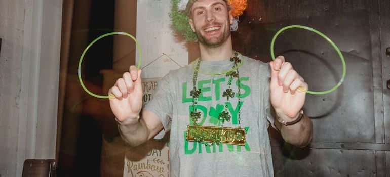 a guy smiling on and having fun on St Patrick's Day events in Miami
