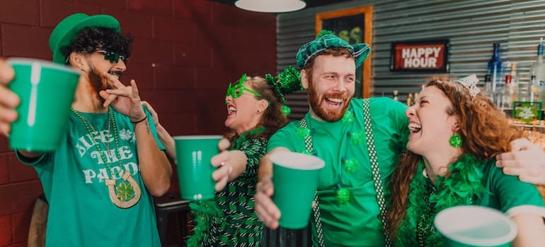 2 men and 2 women having fun St Patrick's Day events in Miami