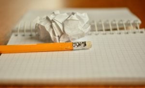 Picture of a pencil and a piece of paper. Devise a plan that you will use as your long distance moving guide 