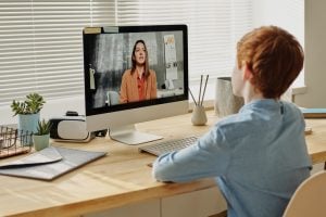 child participating in an online class