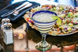 margarita and a plate of food