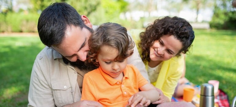 a family in the park after moving to Plantation