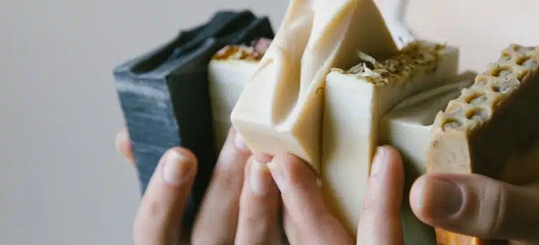 A Woman Holding Soap Bars
