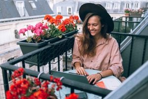 woman working on a balcony