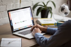 a person looking at a laptop