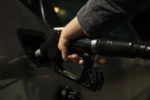 A person pouring fuel