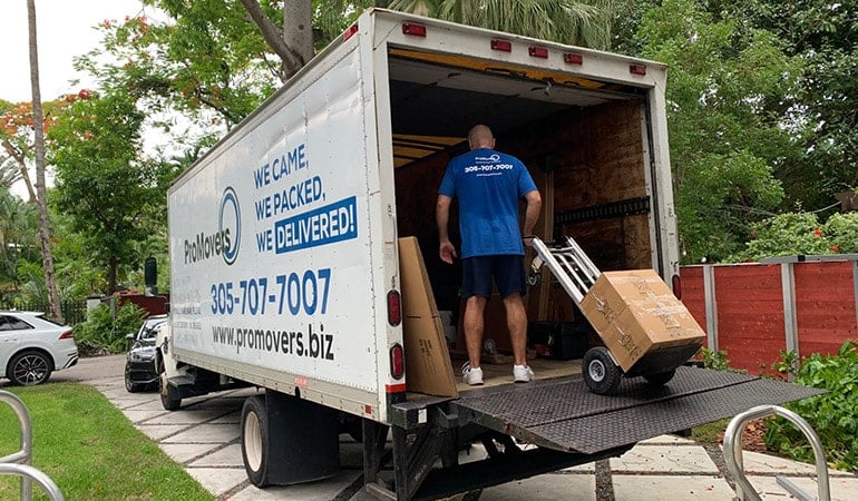 movers north Miami FL in a moving truck ready to transfer your items.
