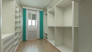 an empty white walk-in wardrobe with a window and green curtains