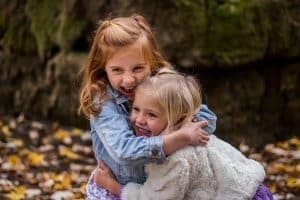 two girls hugging each other