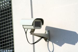 A surveillance camera on the wall of your new home can maintain security during a move from Florida